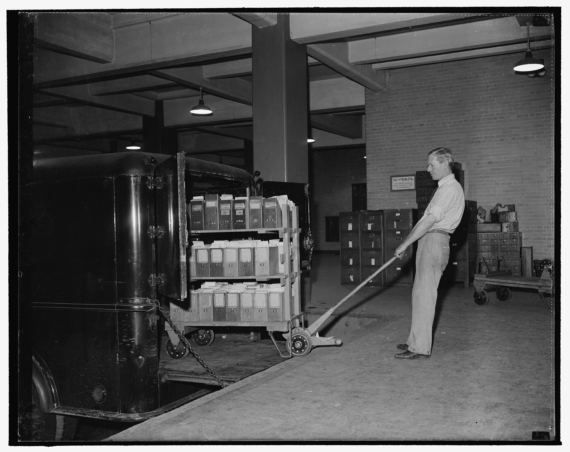 Title: Historical documents guarded with great care by National Archives. Washington, D.C., Nov. 22. The treatment and careful handling of valuable historical documents is of prime consideration at the National Archives in Washington, D.C., Records, legal papers, historica data, etc., of all descrip. Work surfaces compared: where archive handling mistakes actually happen