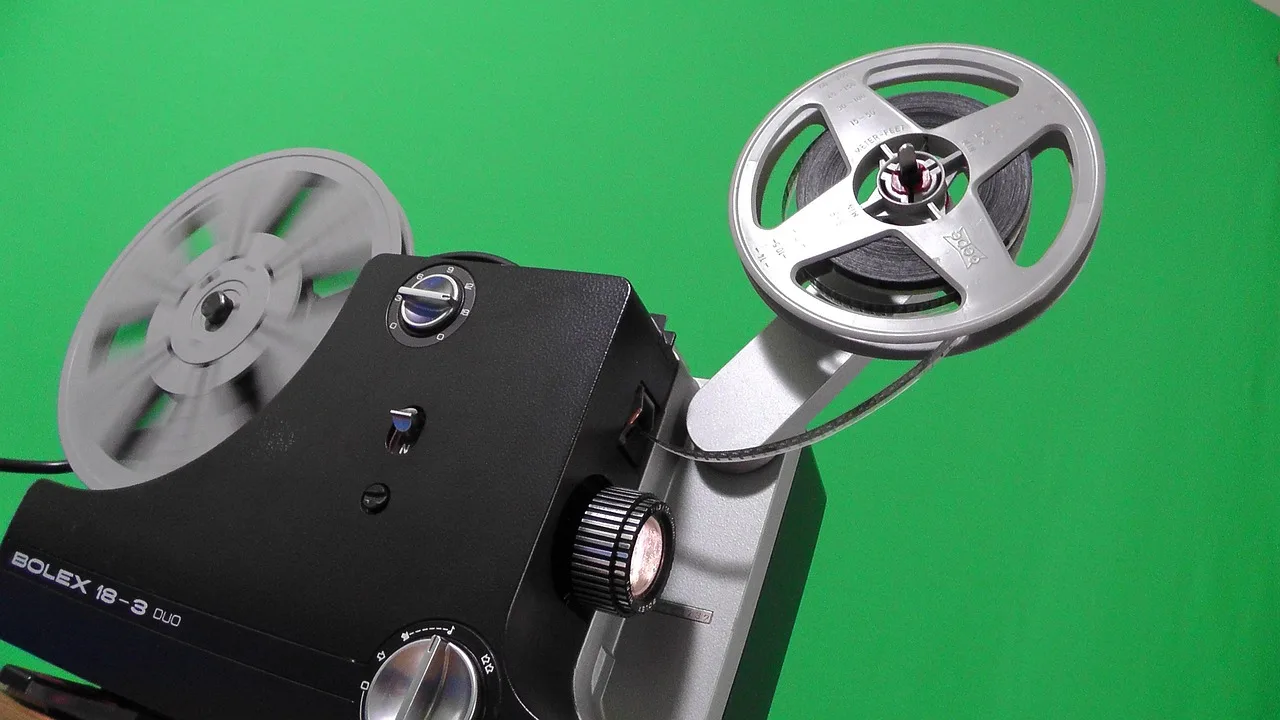 projector, cinema, reel, film, projection, movie collection, amateur movies, archive, green background, movie, light, former, devices, canvas, picture, actors, 8mm, collection. Risk in a photo archive: it follows the material, not the subject